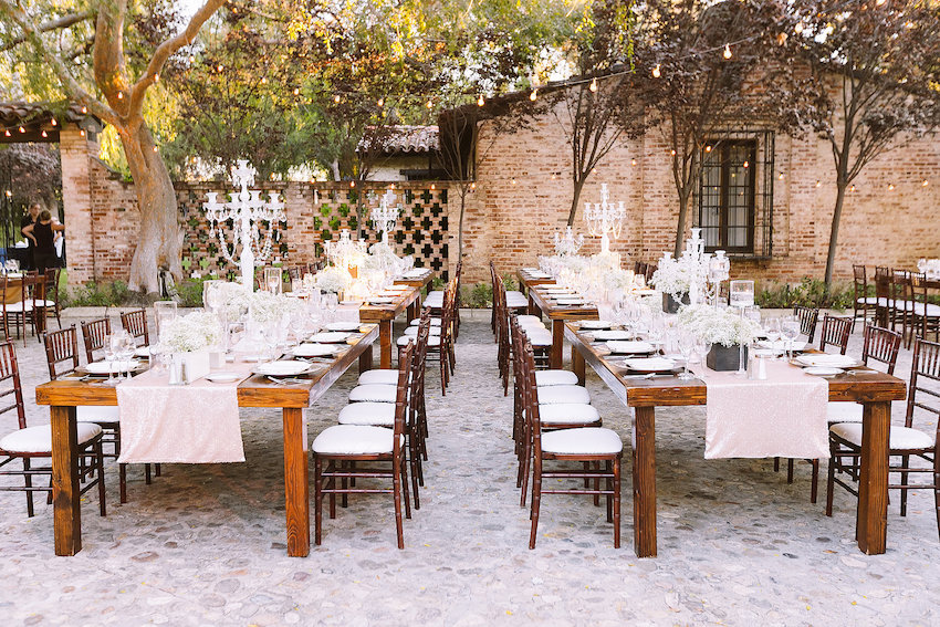 Rustic wedding reception on cobblestone