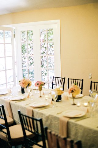 Bridal Shower Tablescape black-chairs-and-rectangular-table-with-ivory-linens