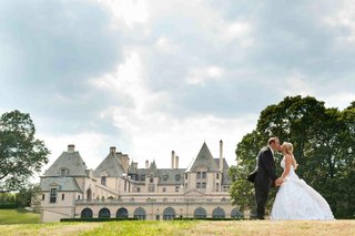 Bride and Groom Kiss at Oheka Castle bride-and-groom-kiss-in-front-of-oheka-castle