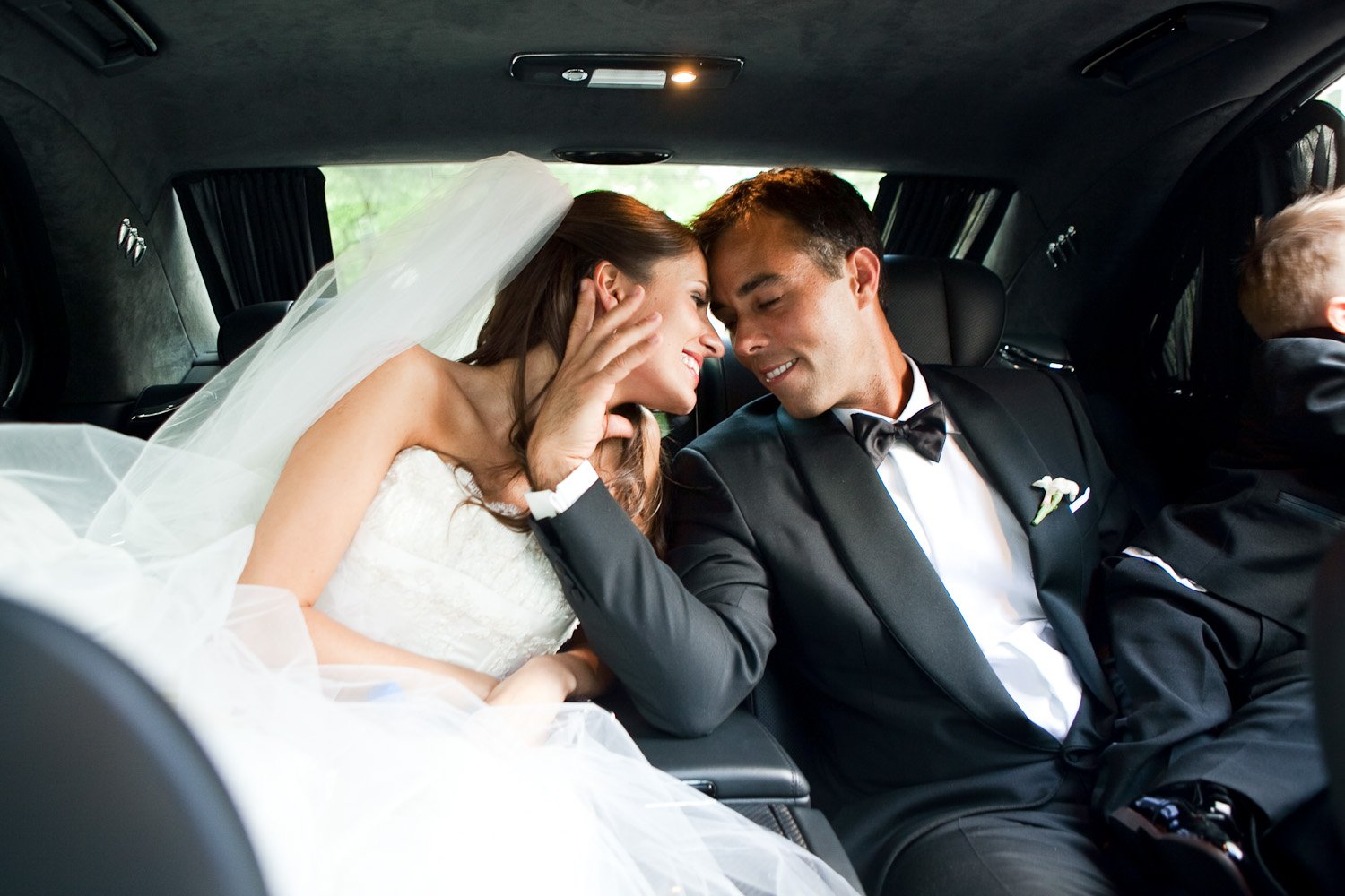 Couples Photos Bride and Groom in Black Car Inside Weddings
