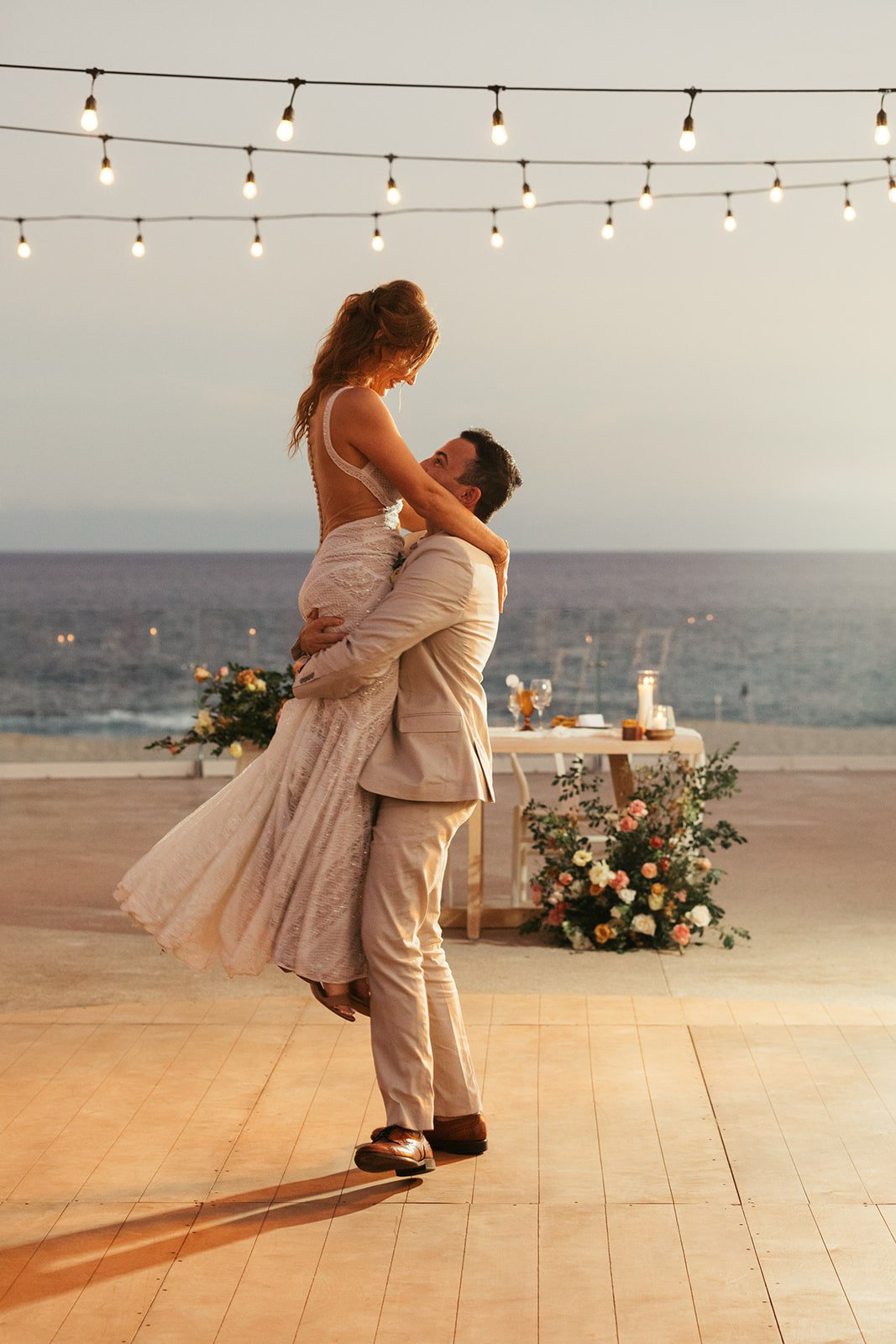 Groom Lifts Bride During Sunset First Dance(01)