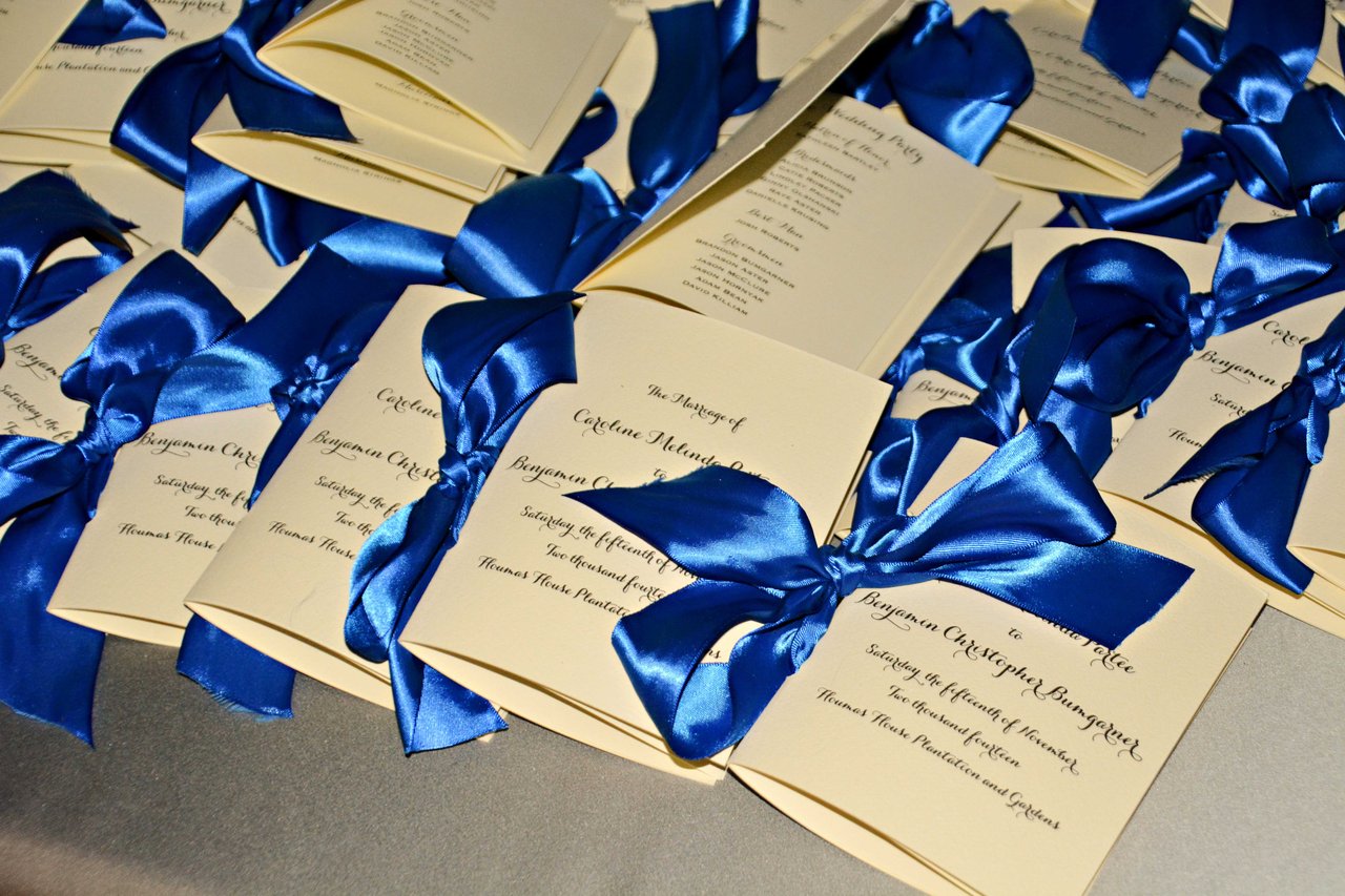 Ivory Ceremony Program with Blue Ribbons
