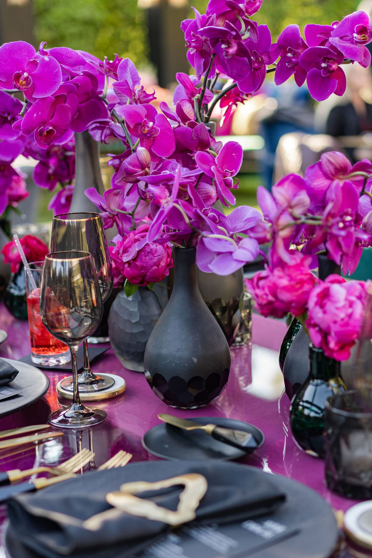 Fuchsia Orchids in Black Vases