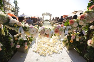 Outdoor Summer Ceremony garland-of-roses-and-bows-in-front-of-ceremony-aisle