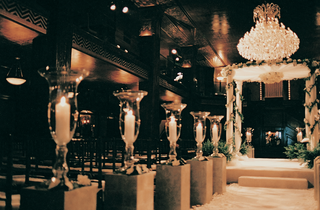 Candle-Lined Ceremony Aisle candles-and-chandelier-fill-ceremony-room