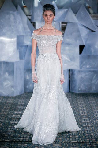 "Arin" by Mira Zwillinger mira-zwillinger-spring-2019-wedding-dress-arin-off-shoulder-gown-silver-vertical-sequins