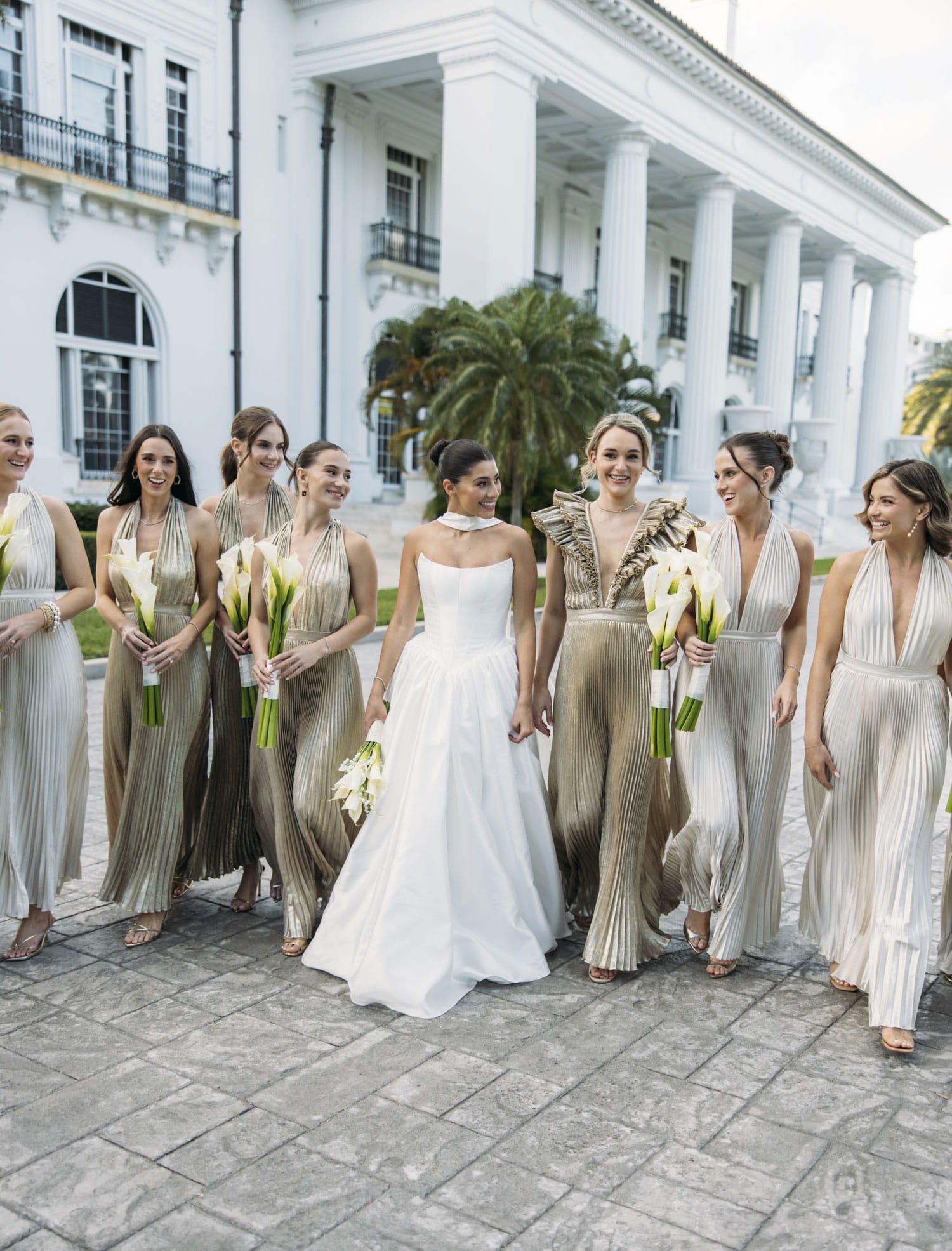 Gold bridesmaid dresses and white calla lily bouquets for gold and white wedding