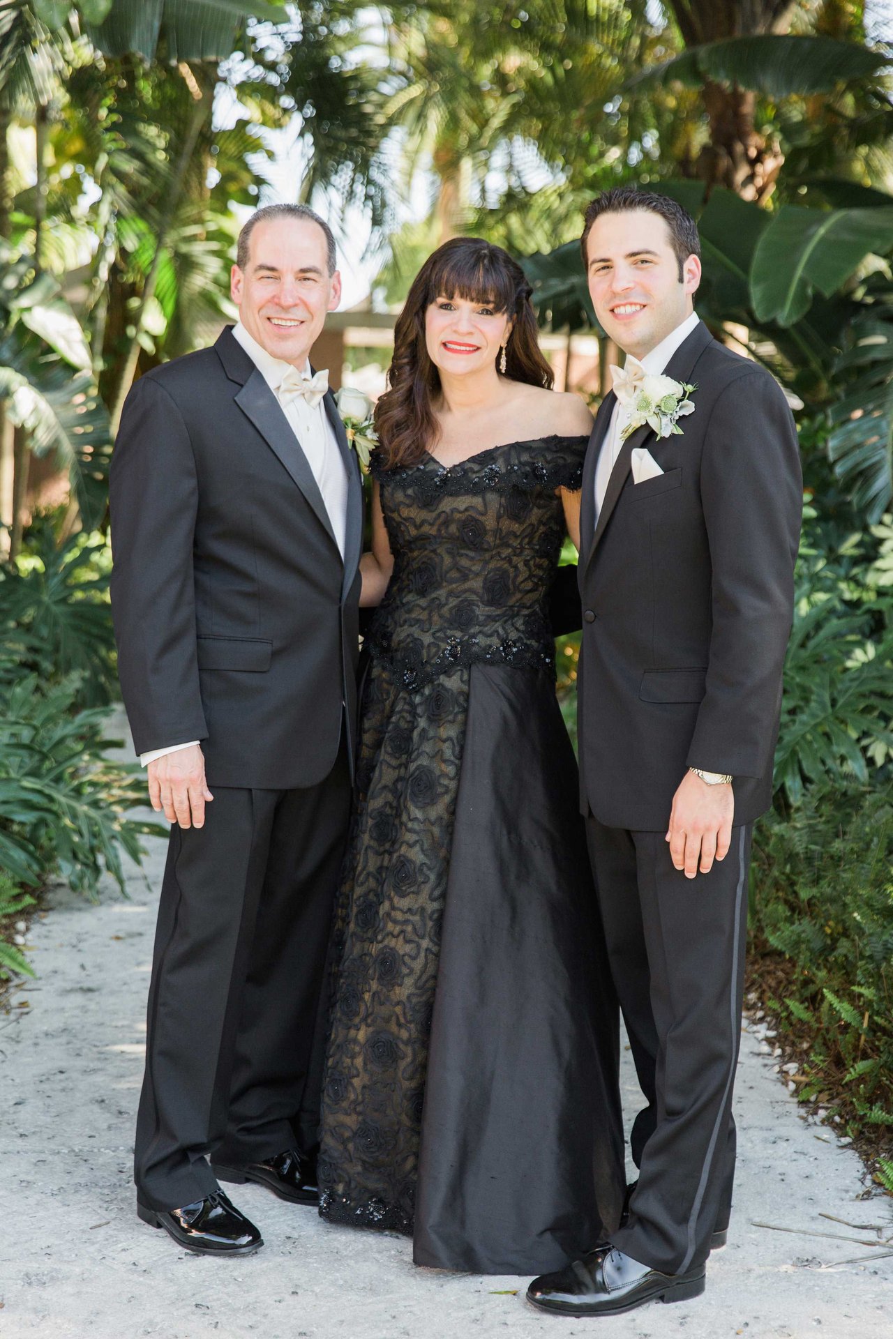 Groom, Parents in Wedding Attire
