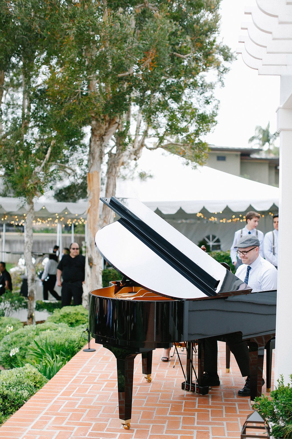 Pianist in Newsboy Cap at Piano