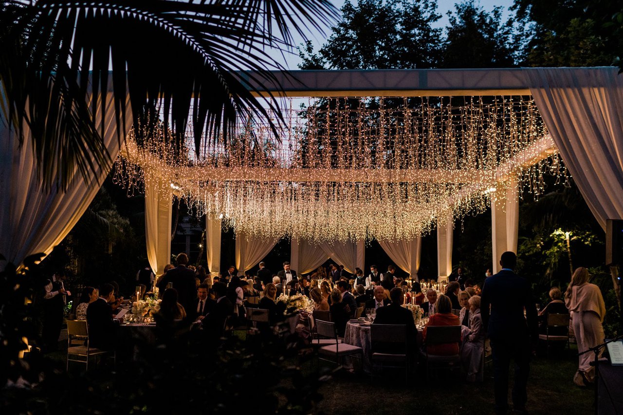 String Light Canopy Over Wedding Guests