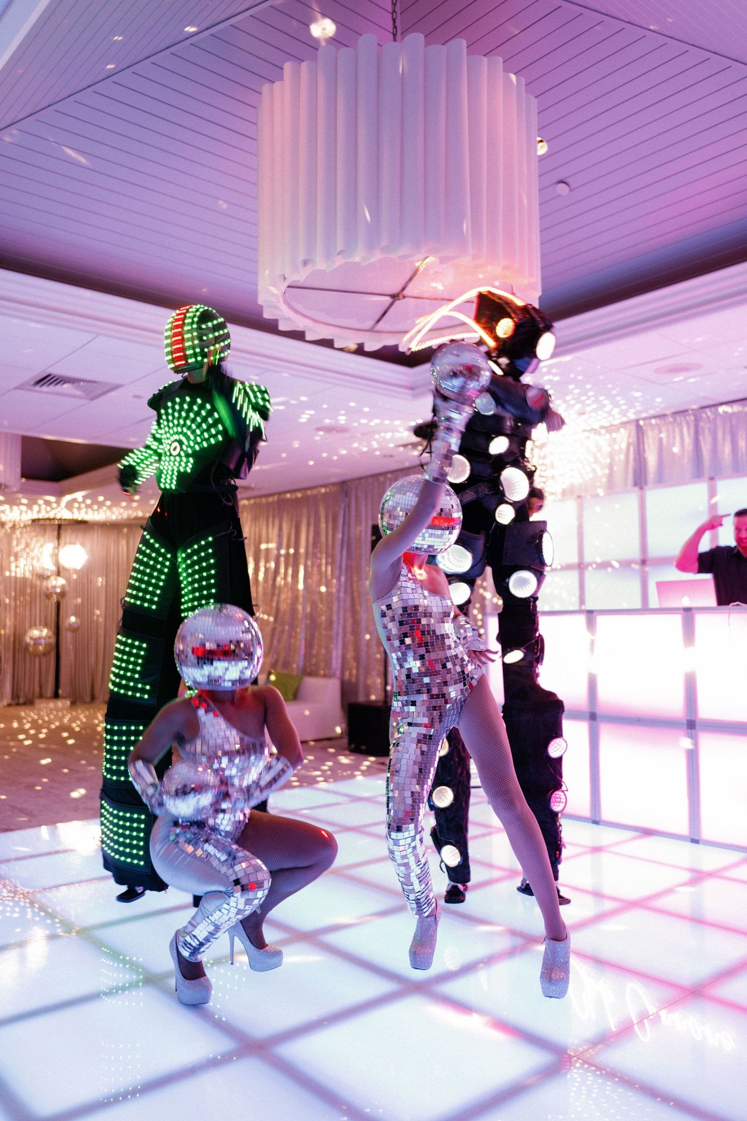 led light performers and disco ball dancers at wedding after party