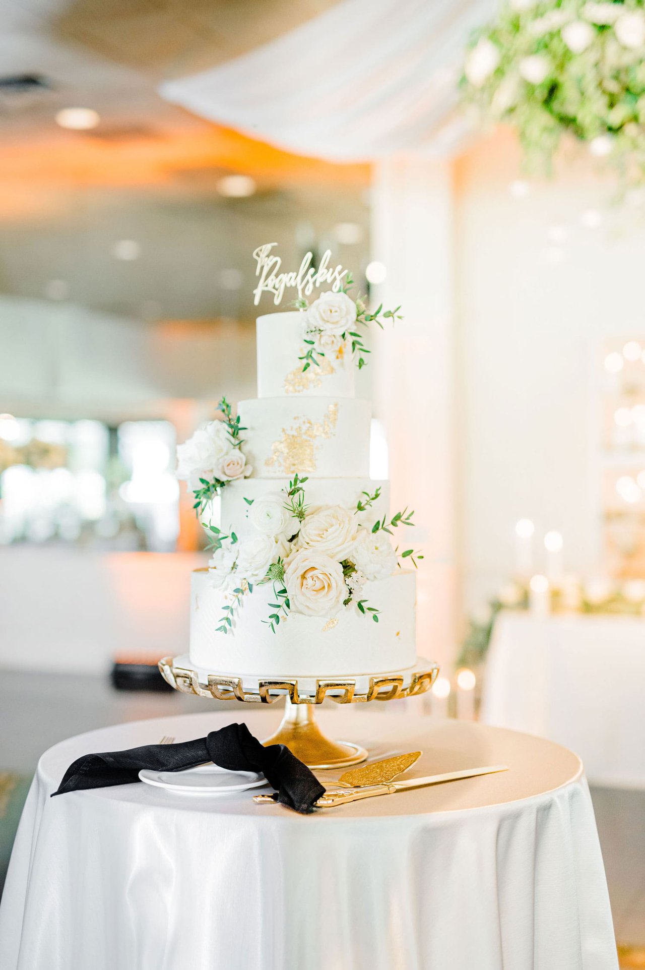 White & Gold Wedding Cake with Greenery