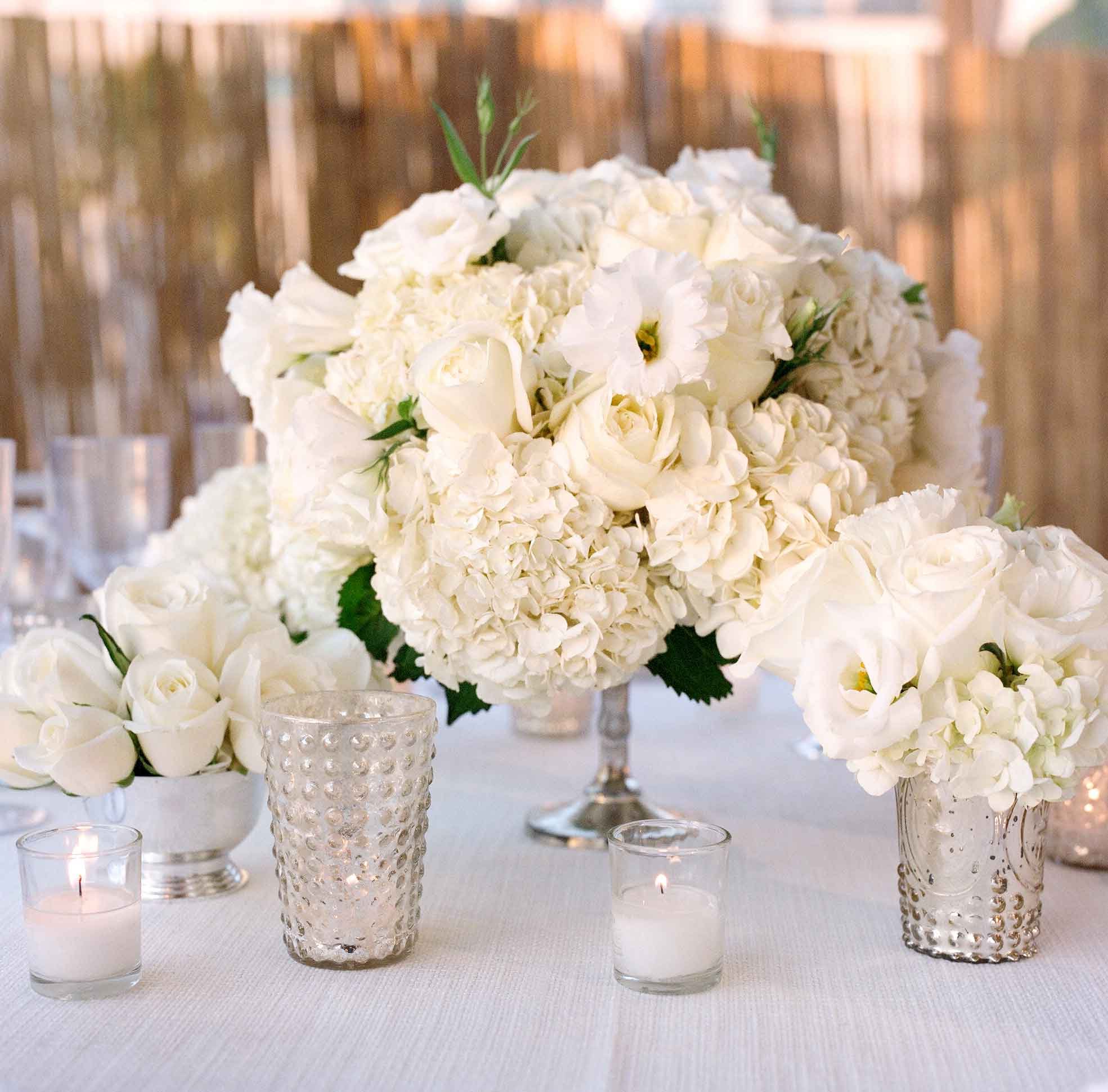 White Bouquets in Silver Vases at Reception