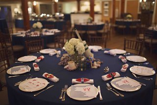 Coastal Tablescape blue-table-with-lobster-details-and-buoy-centerpiece