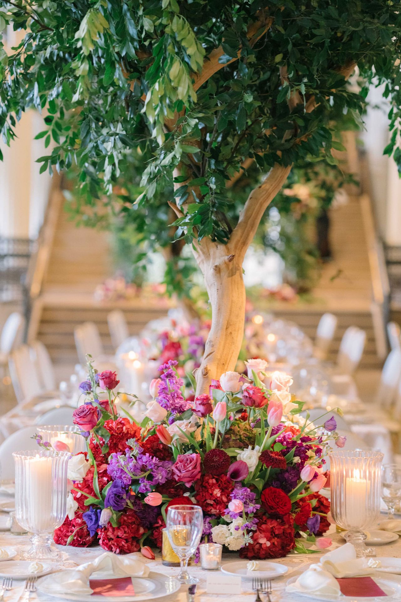 Pink & Purple Flowers at Base of Tree Centerpiece