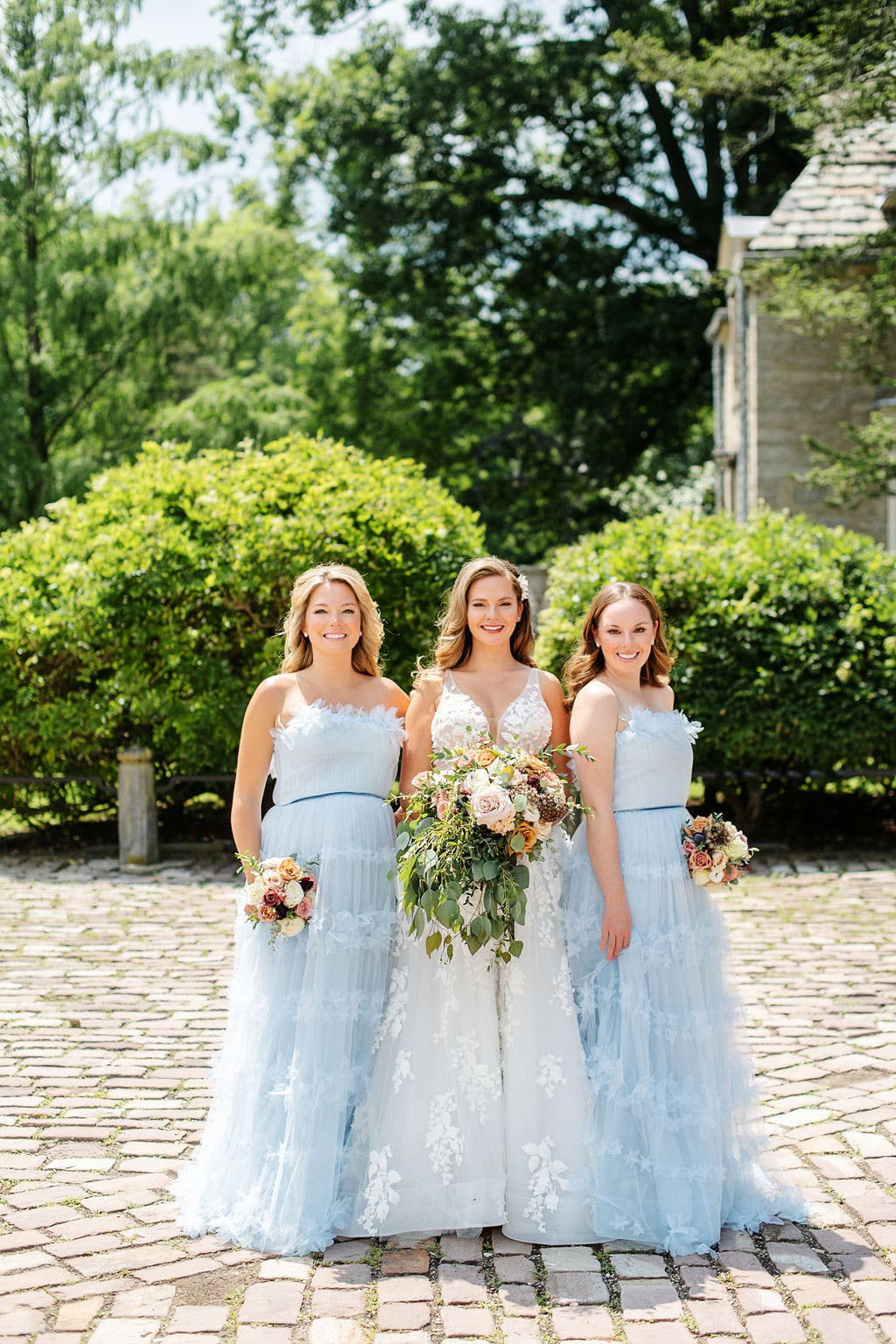 Bride with Bridesmaids in Light Blue Dresses