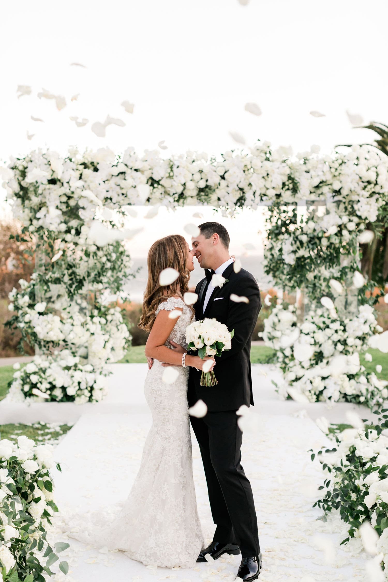 Couple's Kiss with Flower Petal Toss