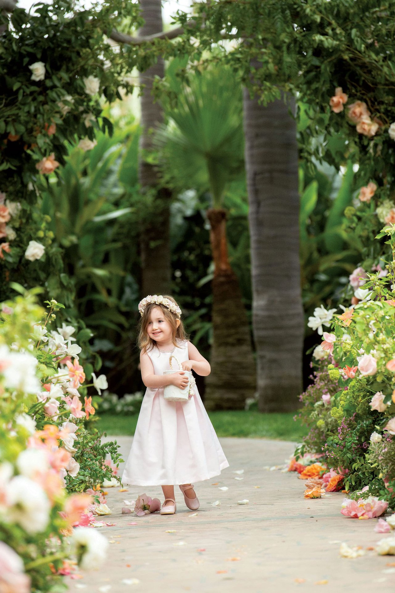 Flower Girl Throwing Petals Down Aisle