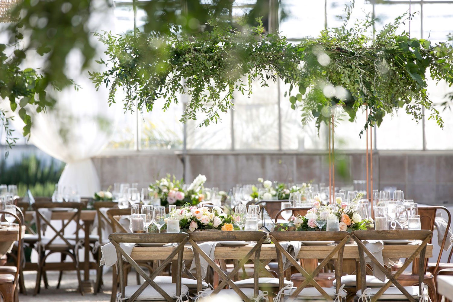 Greenhouse Venue with Wood Tables