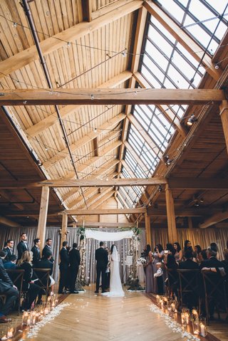 Rustic Ceremony Under Wood Beams
