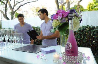 Purple & White Cocktail Bar bartenders-discuss-menu-at-bridal-shower-bar