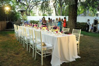 Long Table at Outdoor Bridal Shower long-white-table-with-purple-and-pink-centerpieces