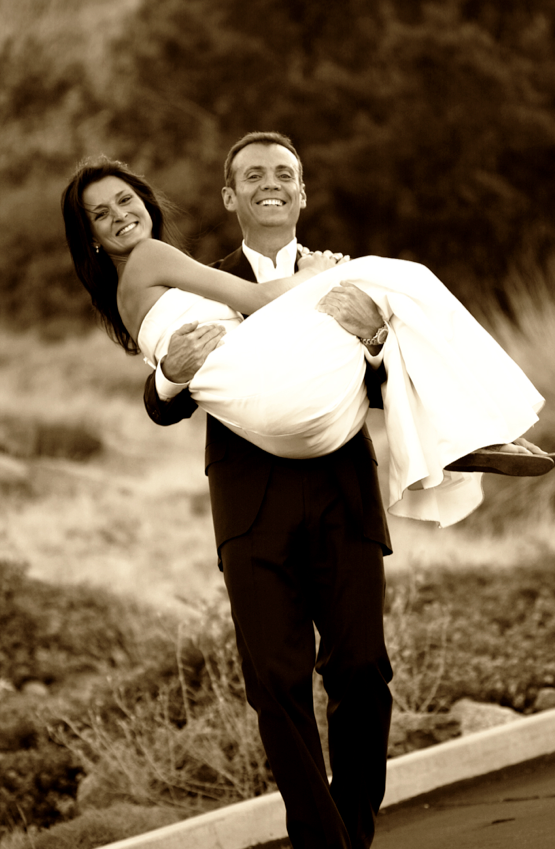 Groom Carries Bride
