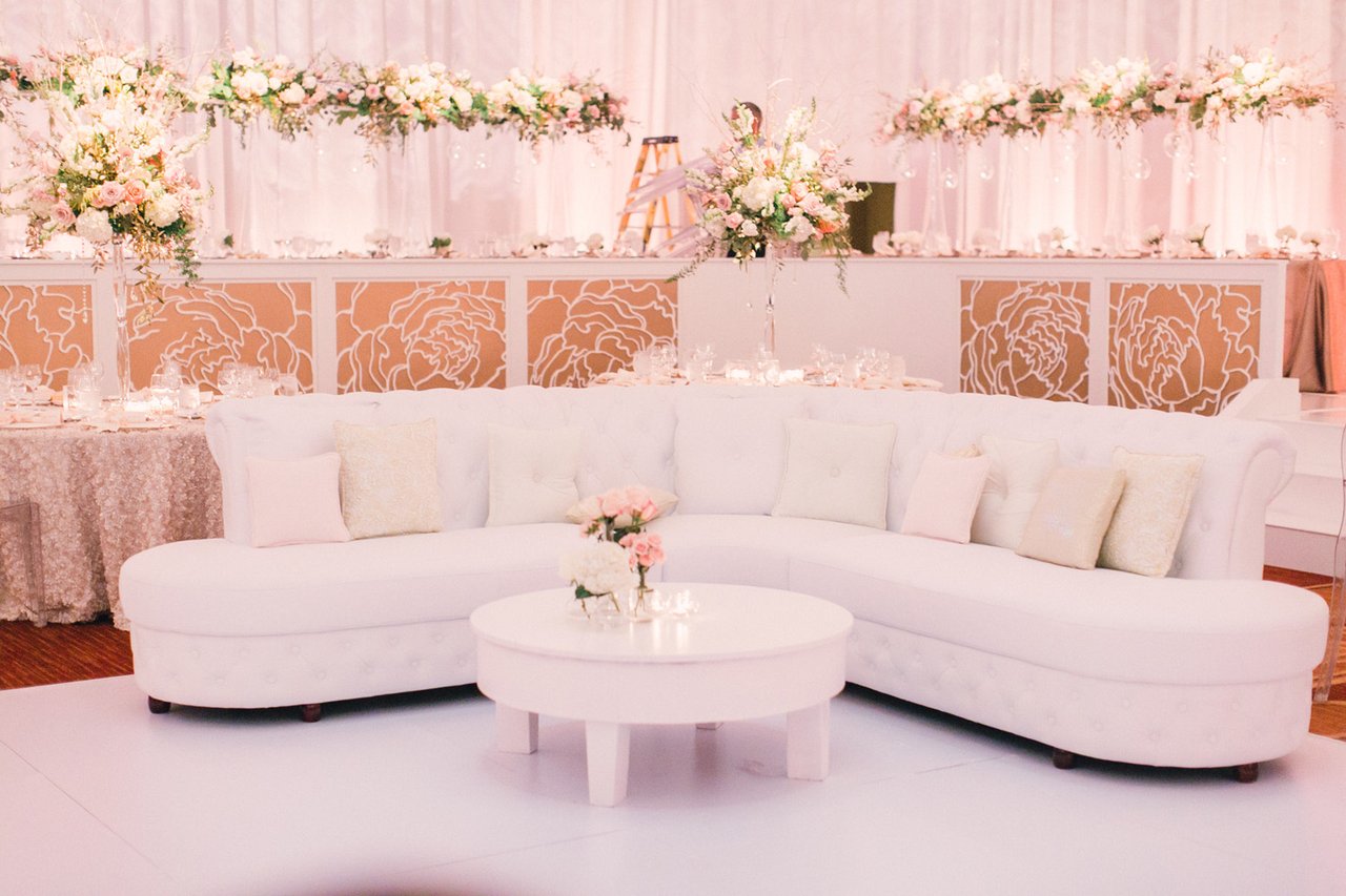 White Sofa with Soft Pink Throw Pillows