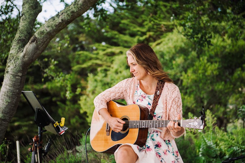 Female Acoustic Guitar Player