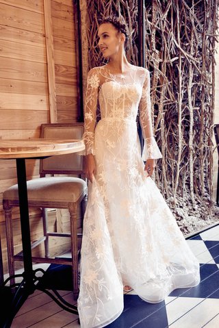 "Clara" by Isabelle Armstrong isabelle-armstrong-fall-2018-wedding-dress-clara-illusion-long-bell-sleeve-gown-floral-detail-corset
