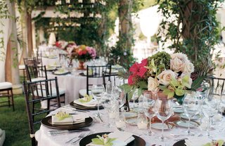 Romantic Garden Tablescape brown-charger-plates-and-chairs-with-pink-linens