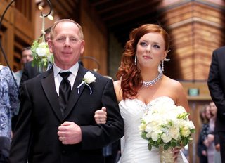 Bridal Processional red-hair-bride-walks-down-aisle-with-father-of-bride