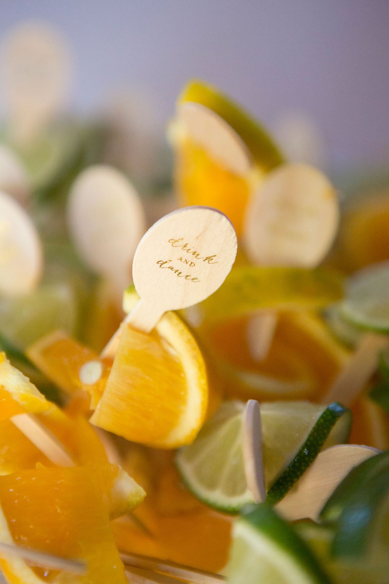 Limes & Oranges with Swizzle Sticks