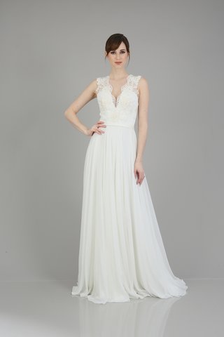 "Alicia" Gown by THEIA an-a-line-dress-with-lace-detailing-on-the-bodice-a-v-neckline-and-a-flowing-skirt-by-theia