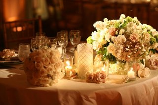Pale-Hued Sweetheart Table pale-pink-linens-and-romantic-floral-arrangement