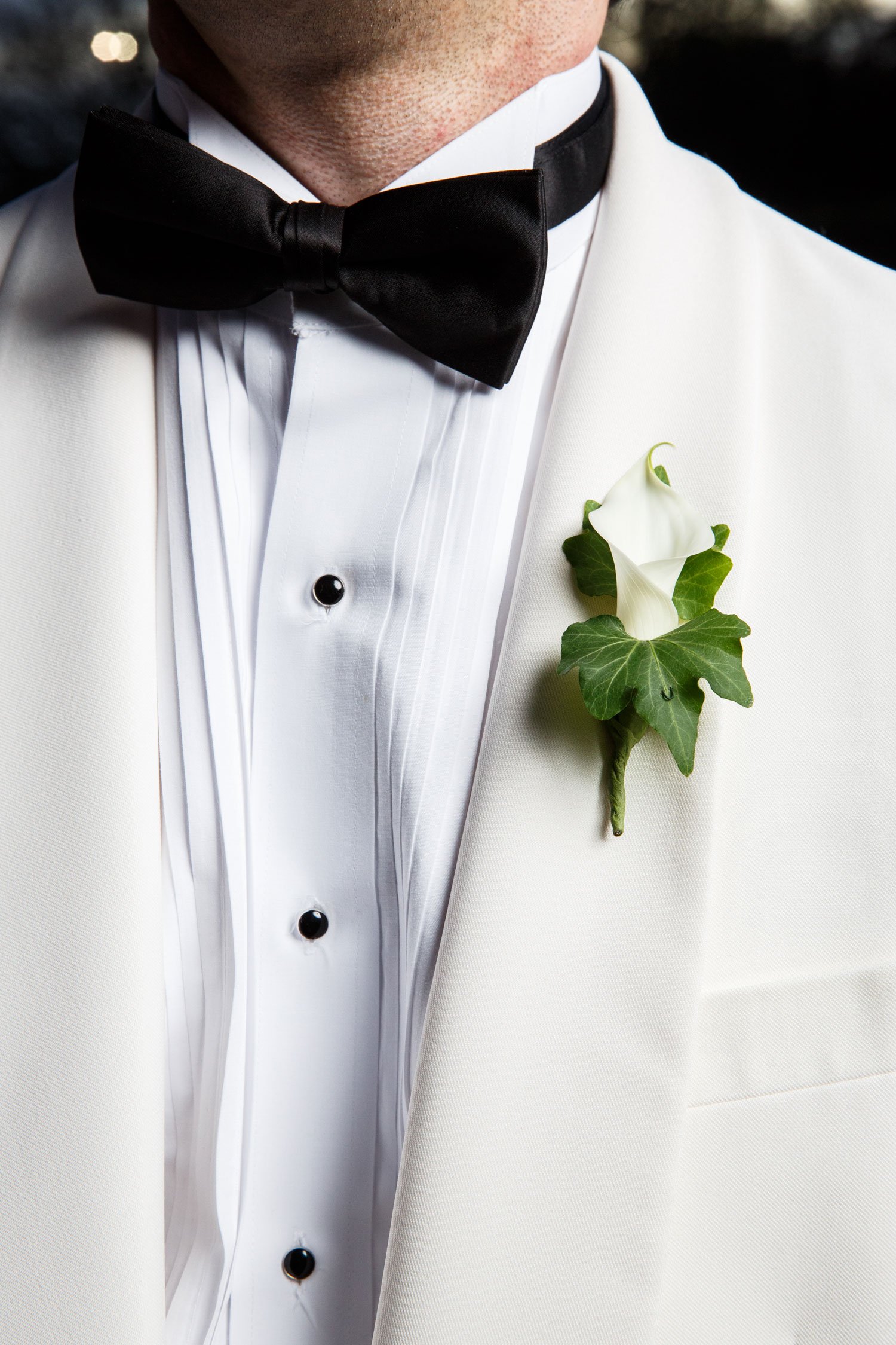 Groom in White Jacket with Boutonniere