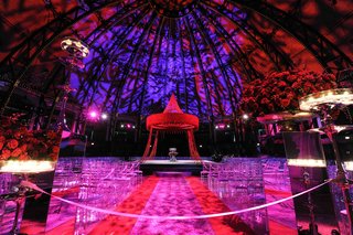 Vibrant Ceremony Décor indian-wedding-under-dome-with-colorful-lighting