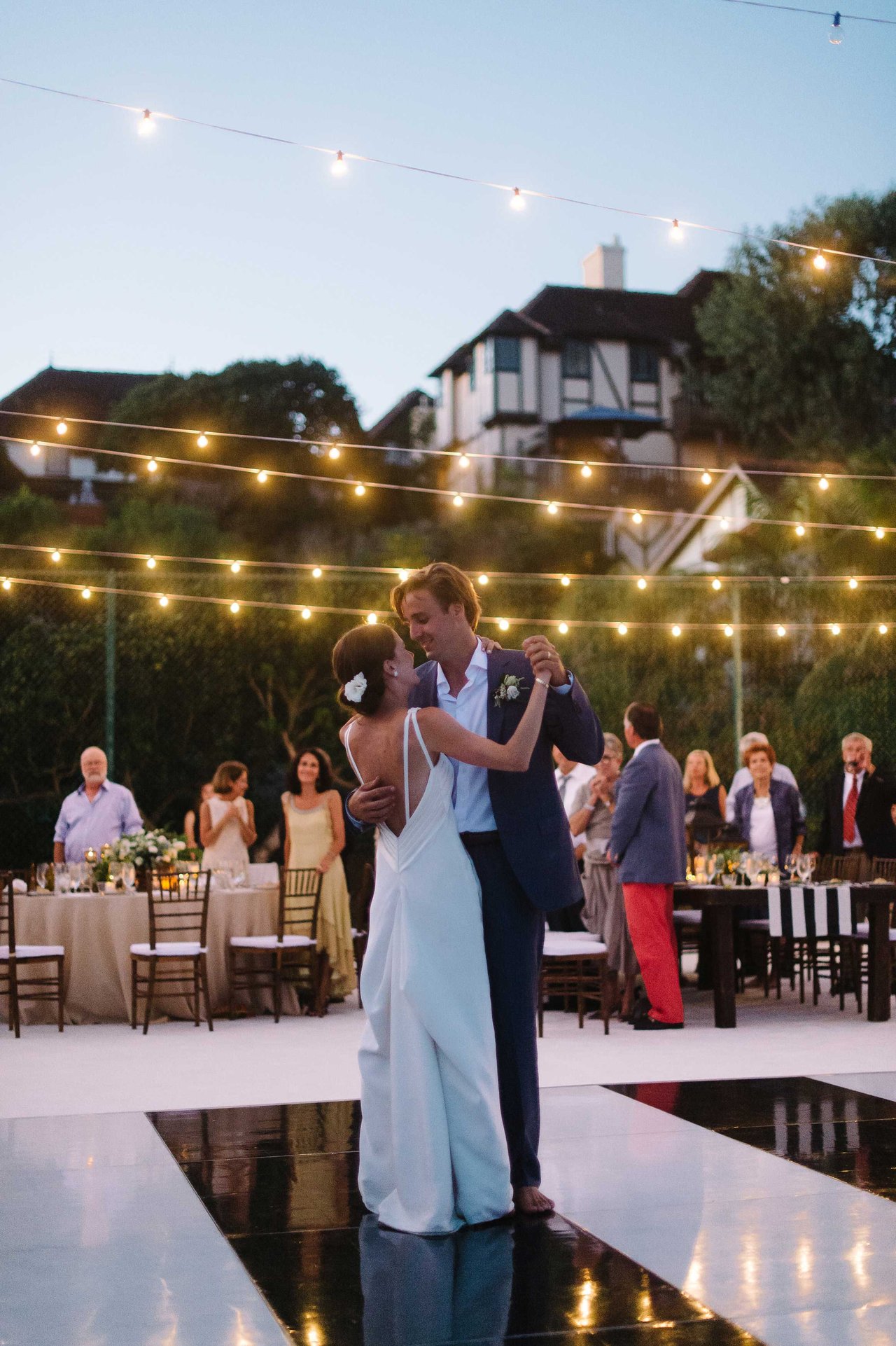 Couple Dances Under Fairy Lights