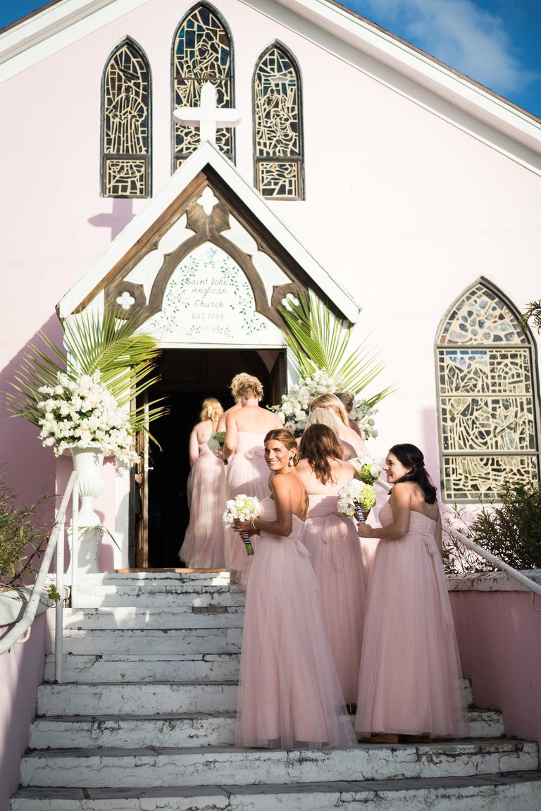 Bridesmaids Entering Pink Church