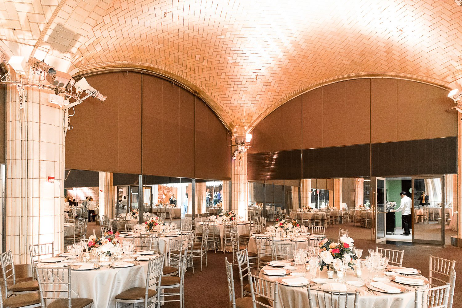 Round Tables at Reception with Tall Arches