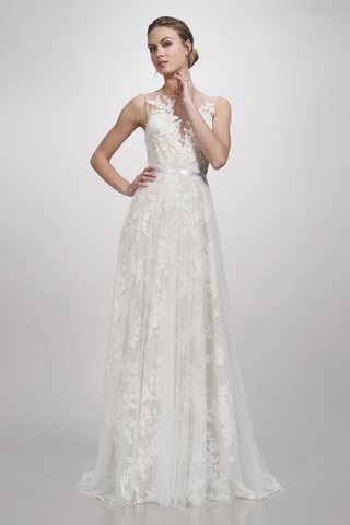 "Ingrid" Gown by THEIA a-gown-with-an-illusion-bateau-neckline-a-thin-belt-a-tulle-skirt-and-floral-detailing-throughout