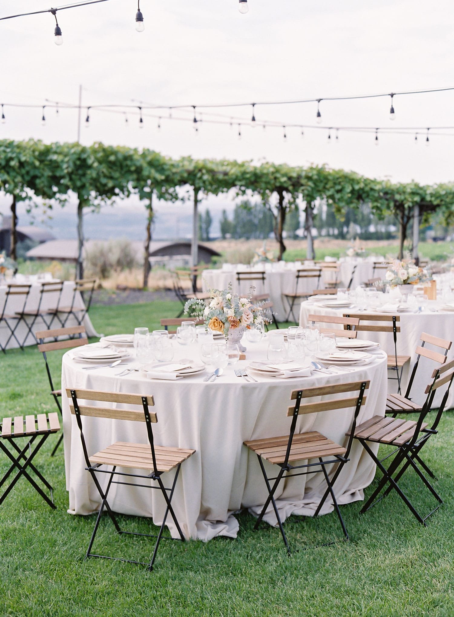 Wood Chairs Around Round Reception Tables