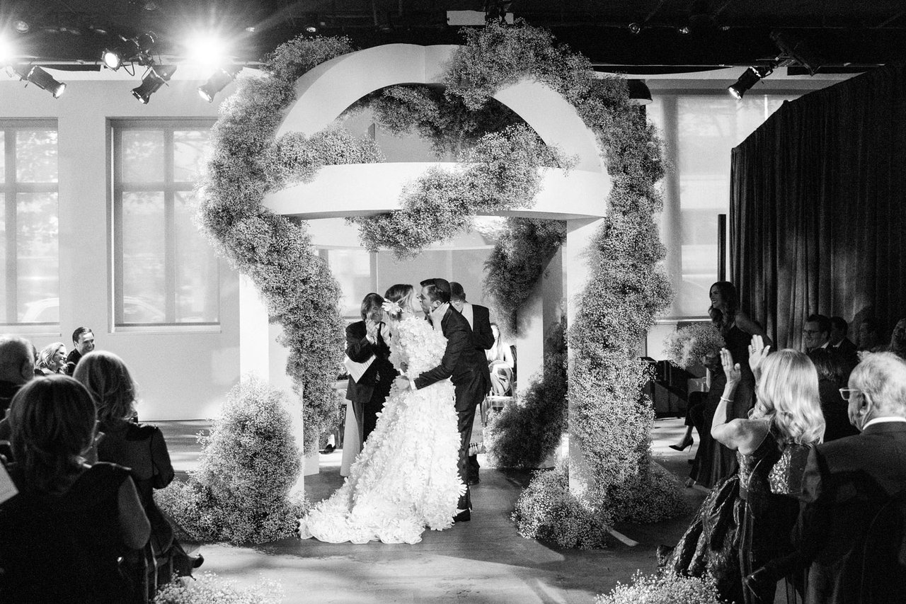 Black & White Ceremony Kiss Under Arch
