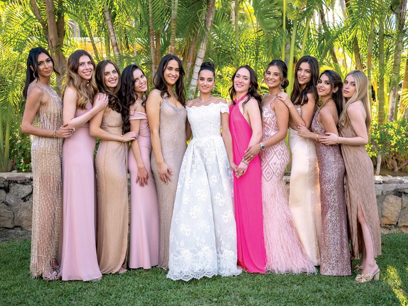 inside weddings magazine wedding magazine spring 2023 bride with friends and bridesmaids in mismatched pink dresses