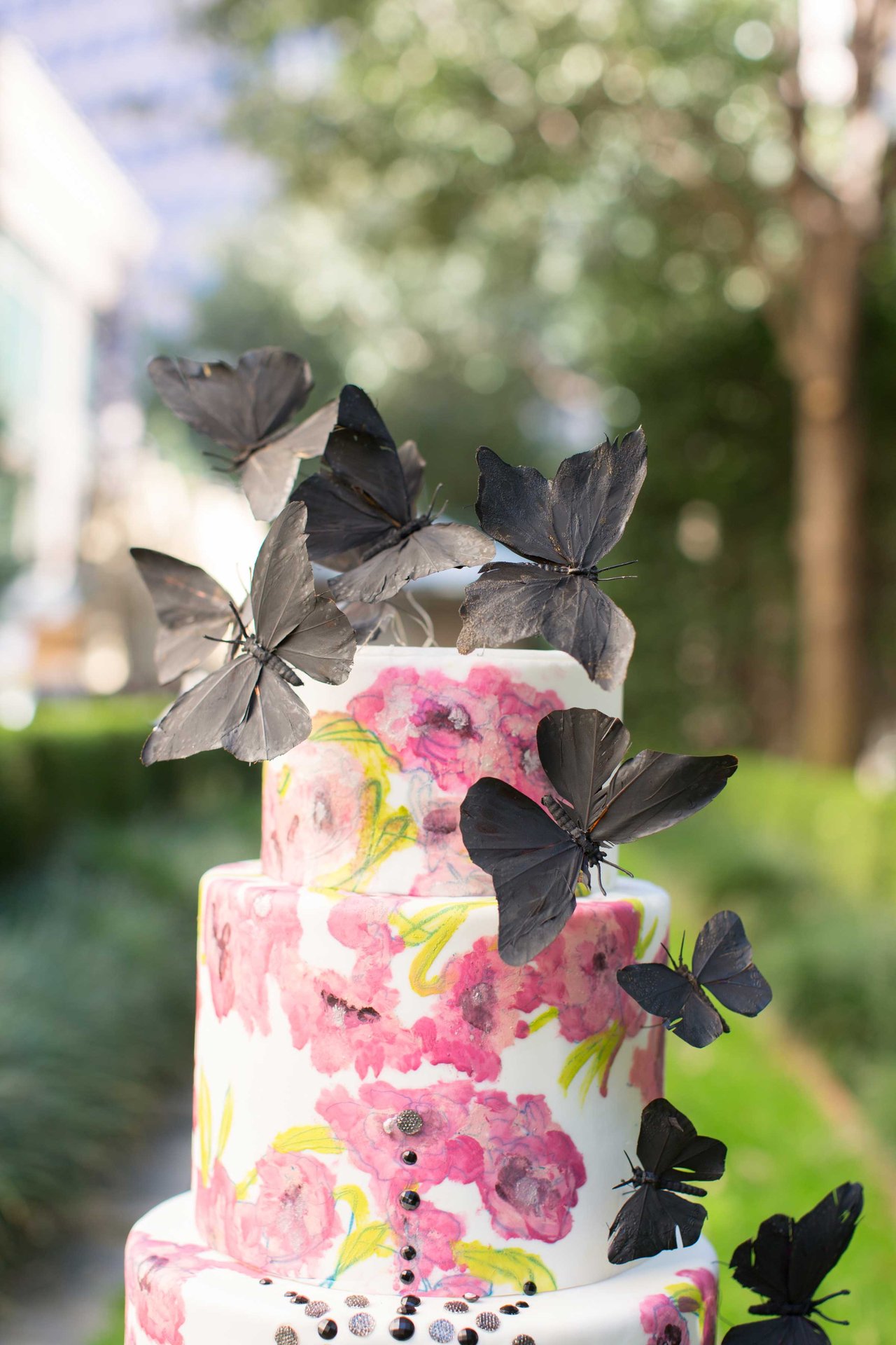 White Cake with Pink Flower Design and Black Butterflies