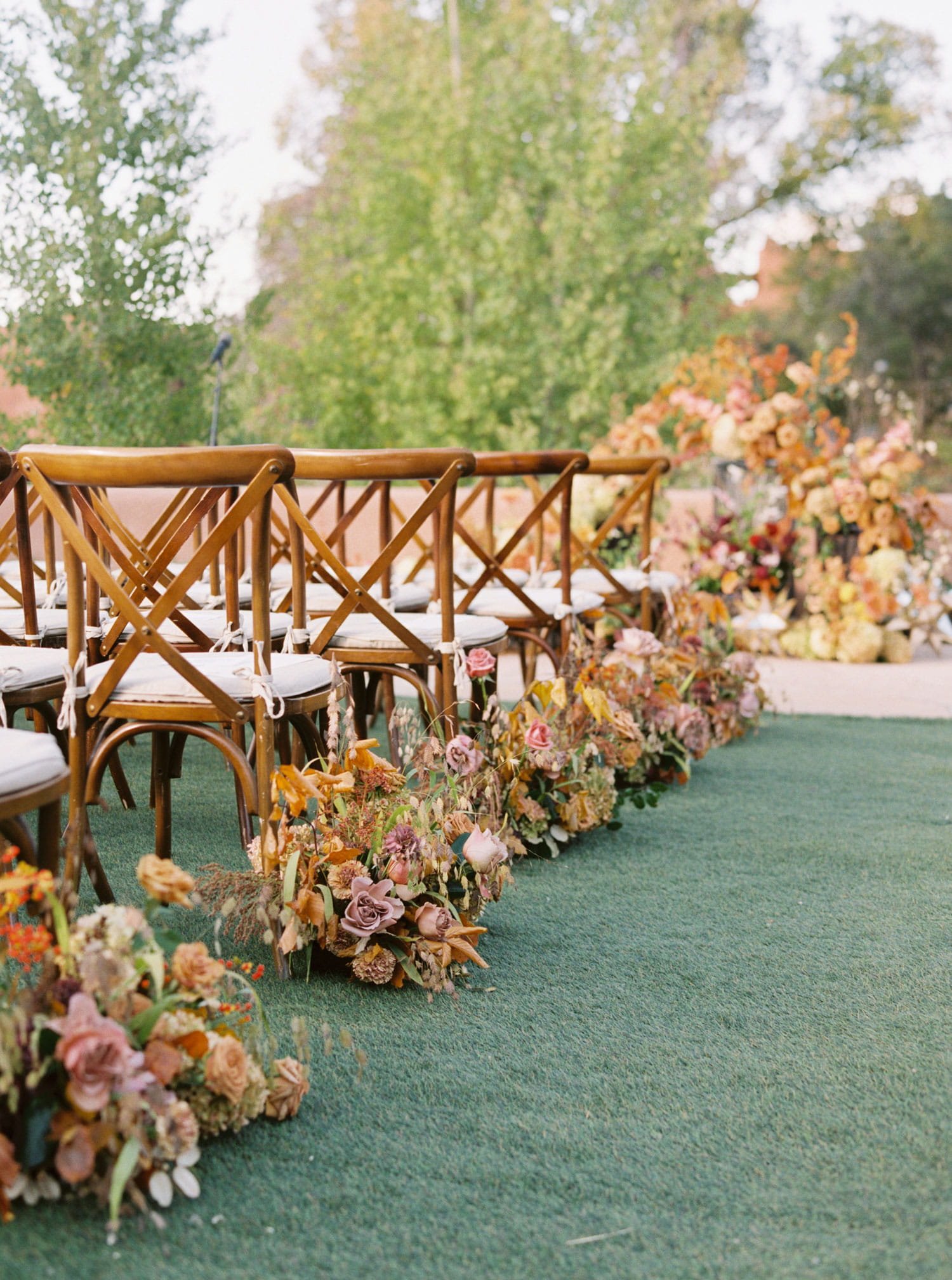 fall wedding ideas outdoor wedding ceremony on grass with fall flowers aisle autumn color palette
