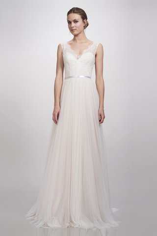 "Elise" Gown by THEIA an-a-line-dress-with-a-slight-v-neckline-illusion-details-in-the-sleeves-a-thin-belt-and-a-tulle