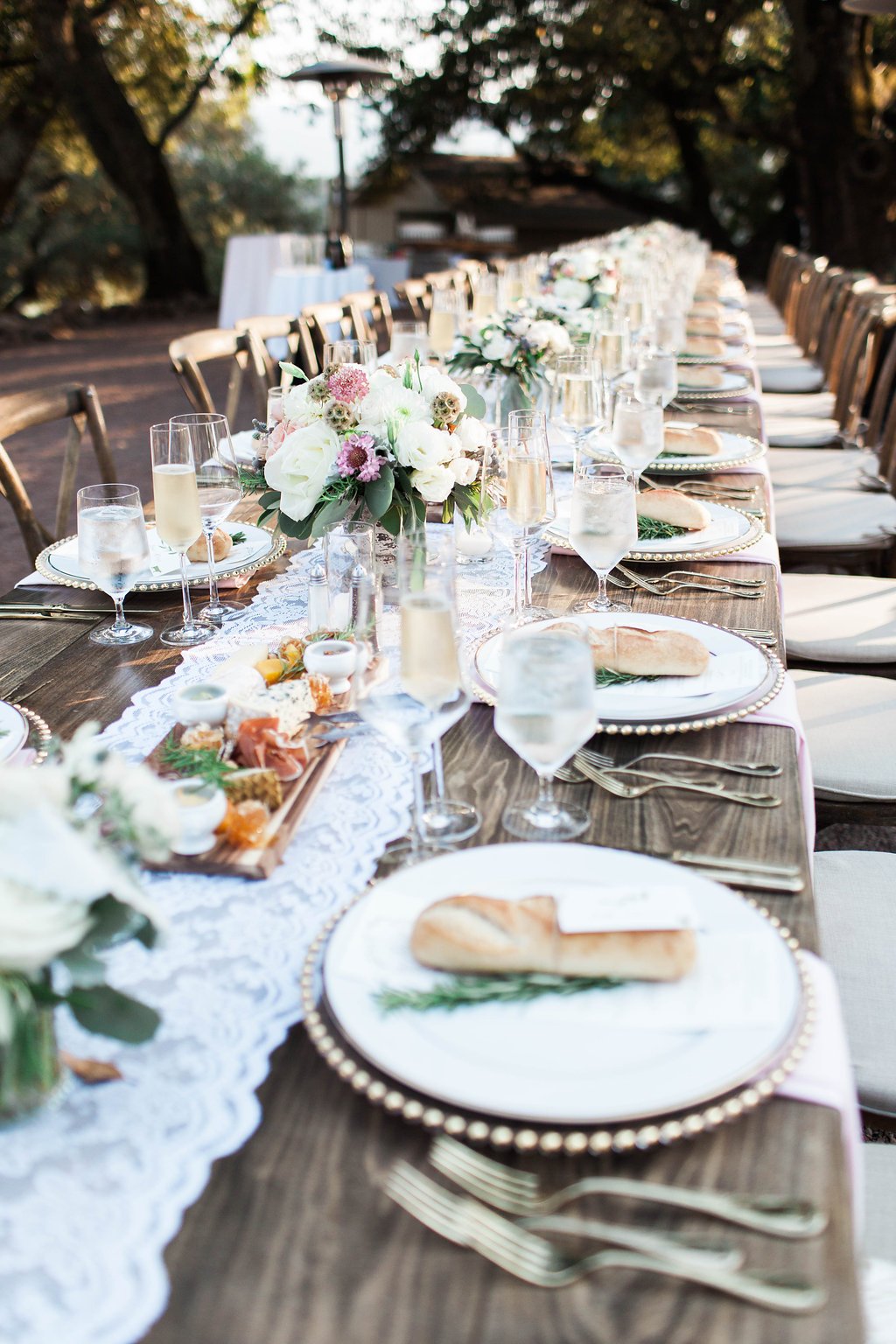 Extended Wooden Tables, Lace Runner, Florals