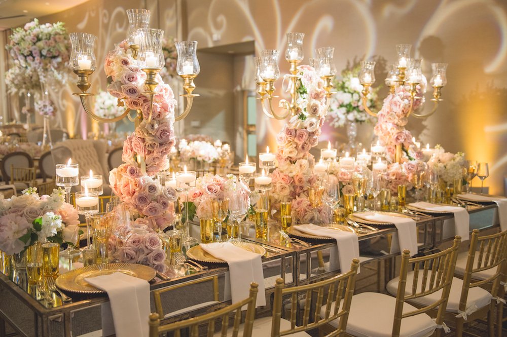 MirrorTop Table with Golden Candelabra Draped in Roses