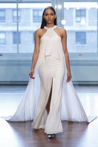 99037 by Justin Alexander 99037-by-justin-alexander-spring-2019-clean-column-gown-paired-with-flowing-cape